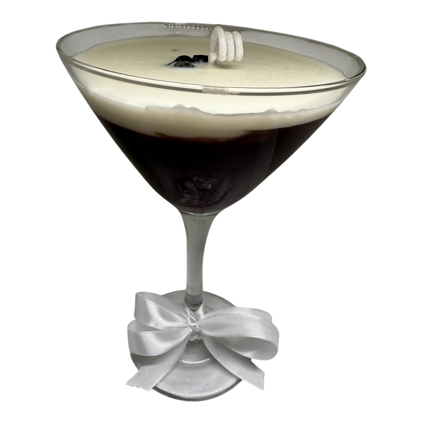 Espressotini Luxe Glow candle in a martini glass design with a creamy top and a decorative ribbon, inspired by coffee martinis.