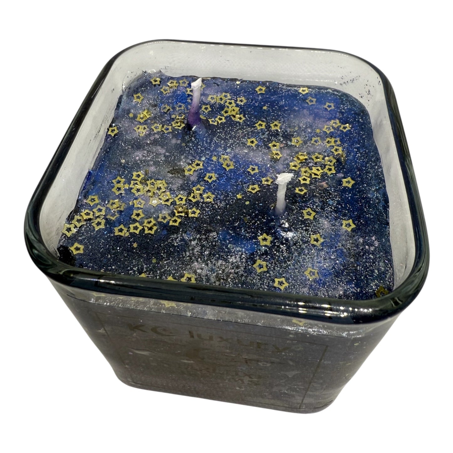 Galaxy-inspired StarLuxe Dreams jelly wax candle with star details by KC Luxury.