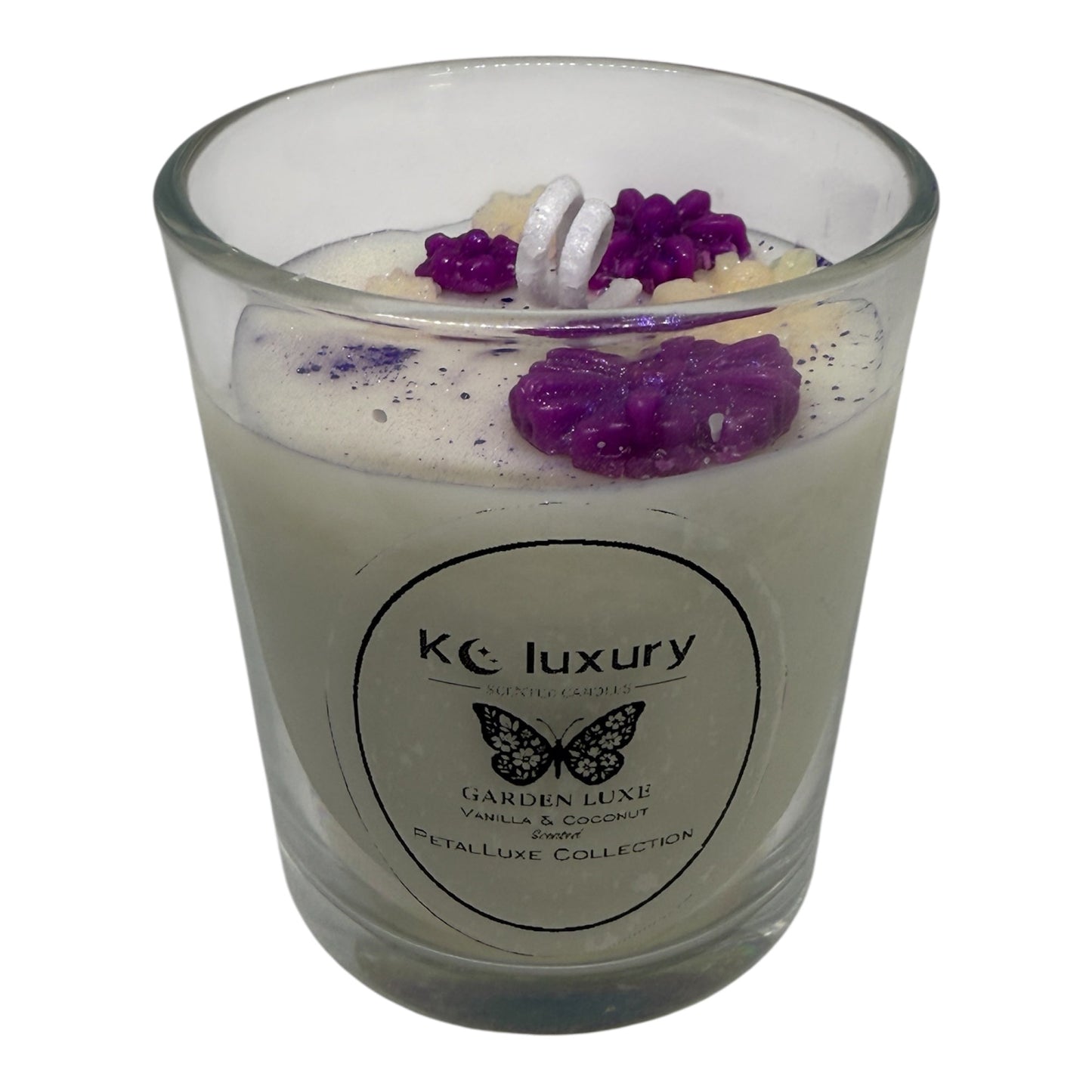 KC Luxury Garden Luxe candle with jelly heart filled with dried flowers and purple floral accents in a clear glass jar