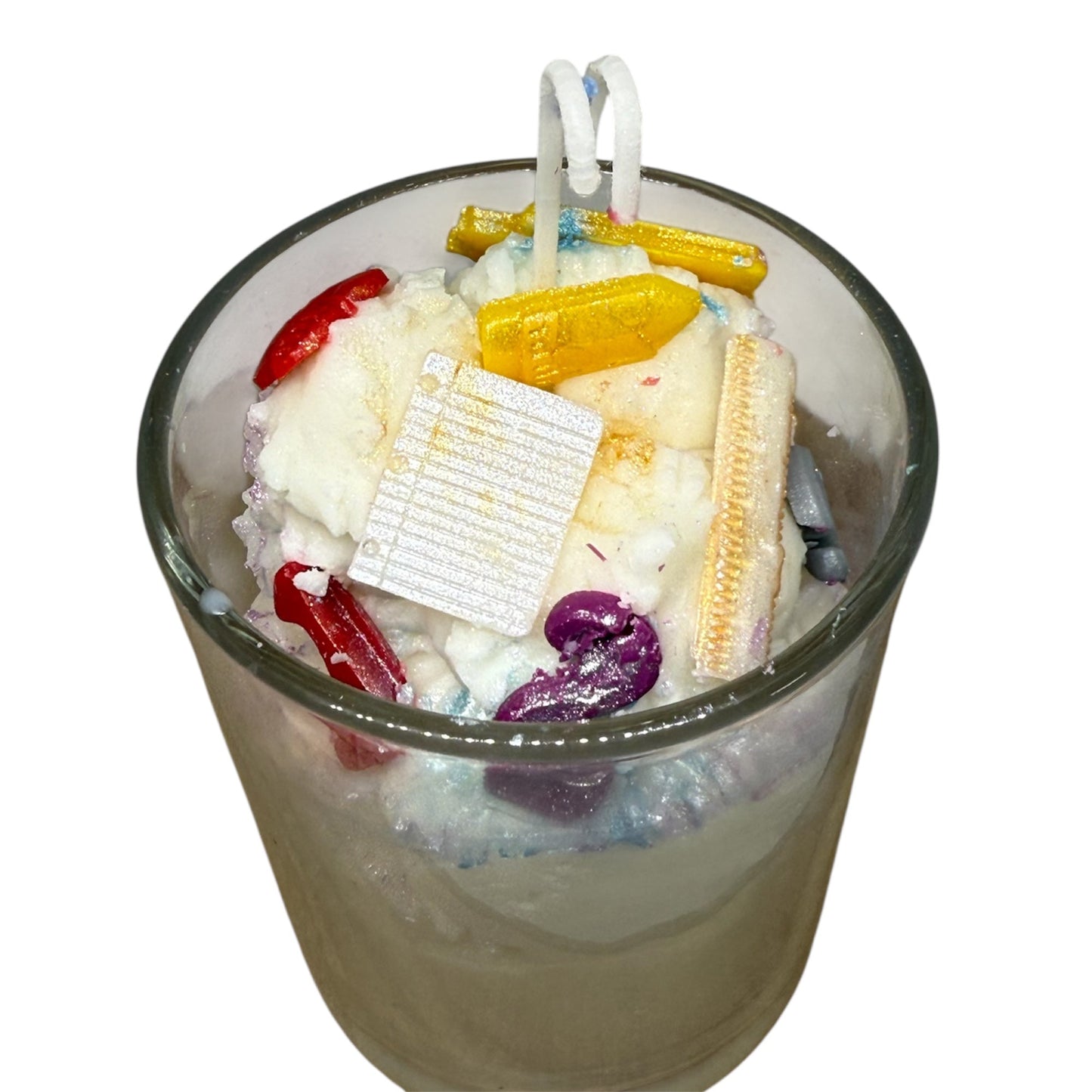 KC Luxury Teachers Glow candle with colorful wax school supplies including a yellow bus, red apple, and pencils in a glass jar