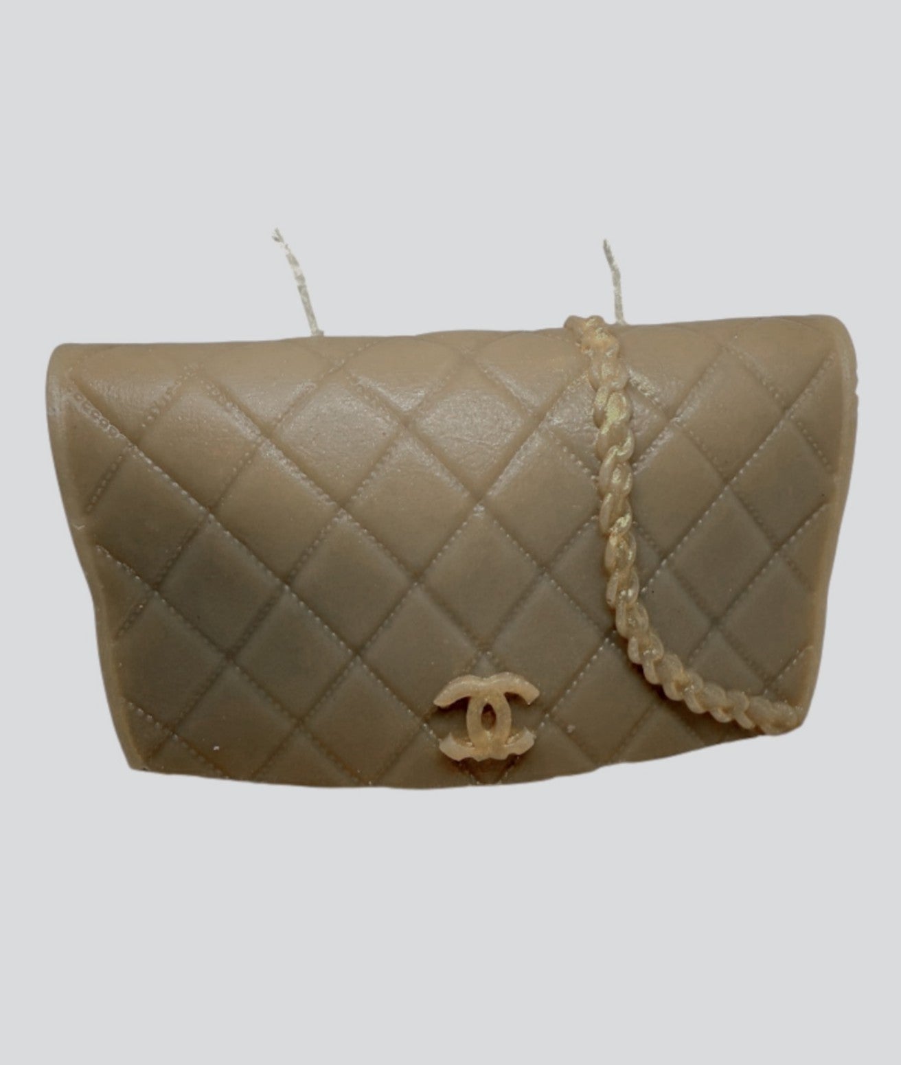 Luxe Couture Purse Candle shaped like a quilted designer handbag with gold-tone chain detail and signature logo, luxury scented decor.