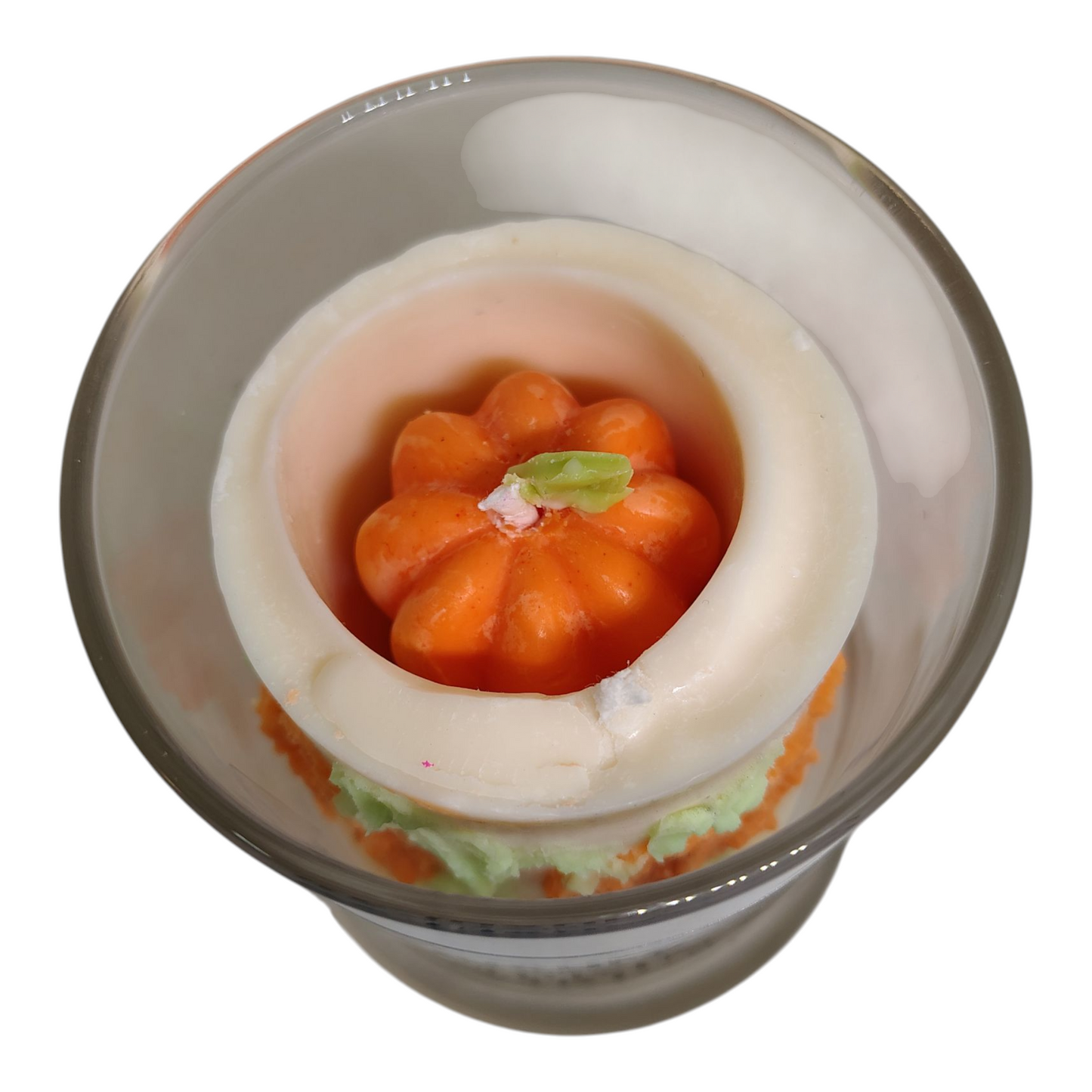 Top view of Pumpkin Swirl Candle by KC Luxury Scented Candles with hidden pumpkin inside and soy wax swirl design