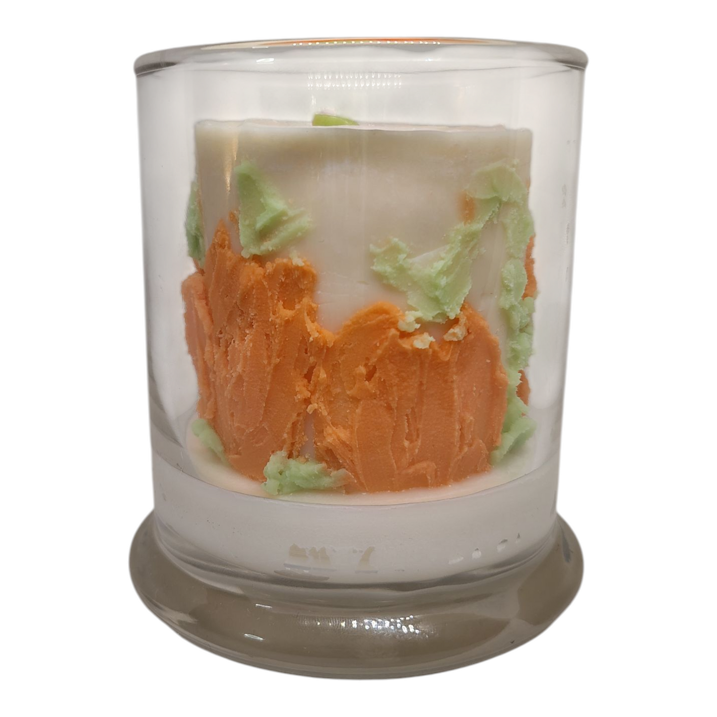 Pumpkin Swirl Candle by KC Luxury Scented Candles showing orange and green pumpkin design in clear glass jar