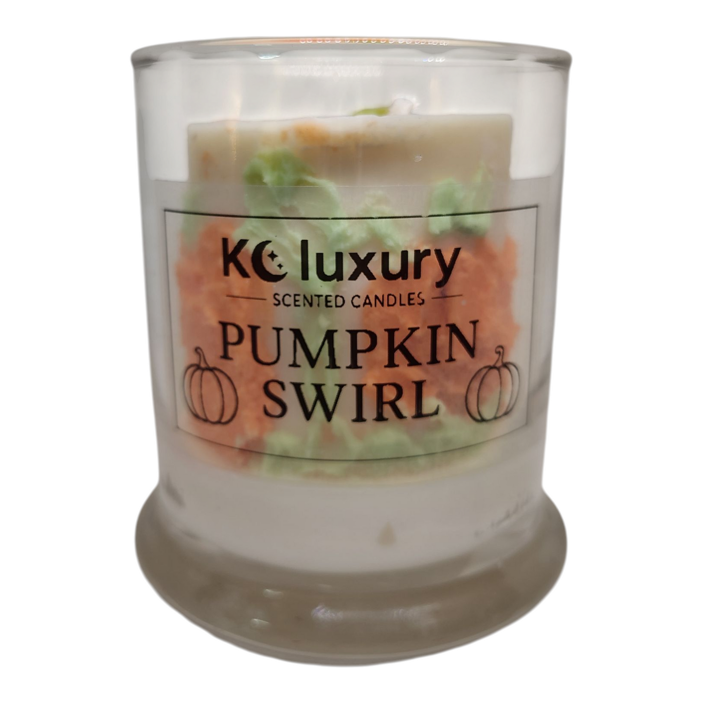 KC Luxury Pumpkin Swirl Candle with two-wick design and hidden pumpkin inside in clear glass jar