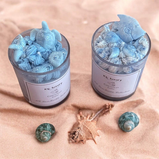 Ocean Luxe hand-poured soy wax candle with ocean-themed wax embeds in reusable glass jars.