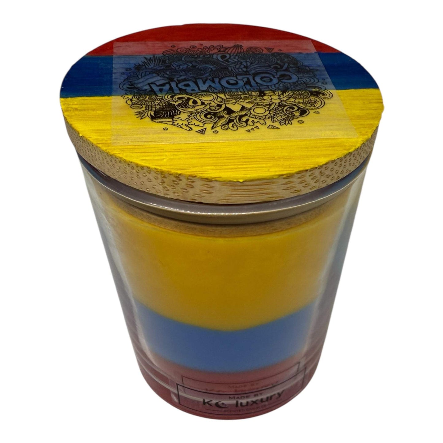 Colombian flag inspired soy wax candle in vibrant yellow, blue, and red layers.
