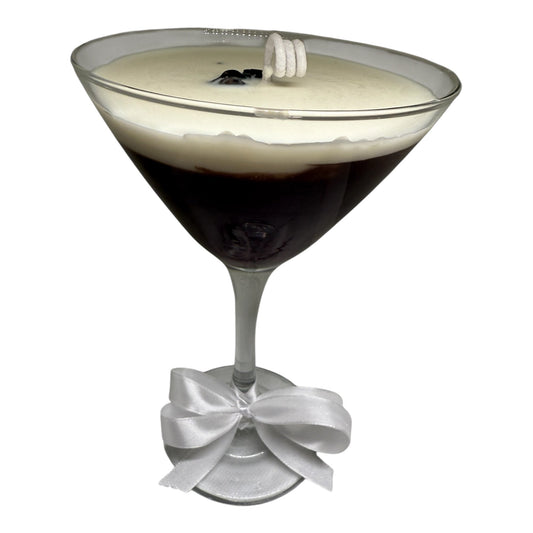 Espressotini Luxe Glow candle in a martini glass design with a creamy top and a decorative ribbon, inspired by coffee martinis.
