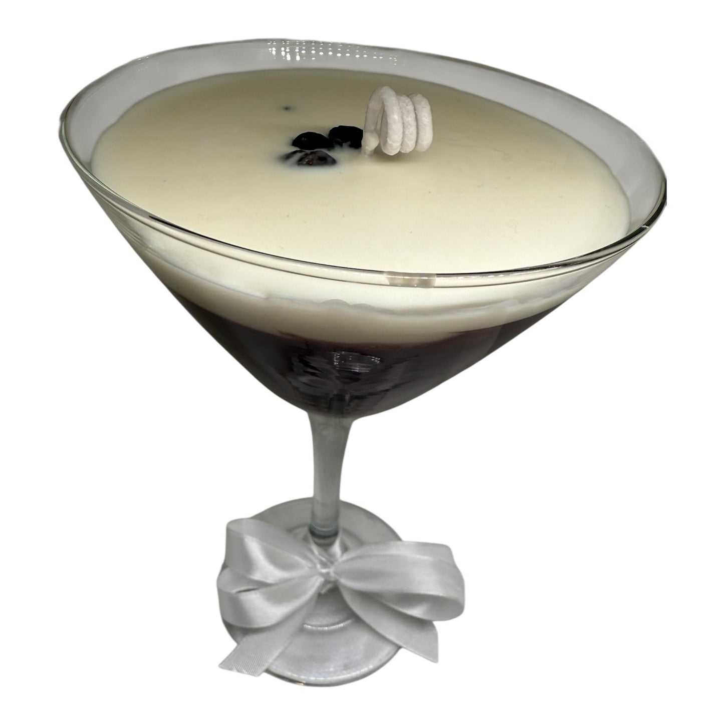 Espressotini Luxe Glow candle in martini glass shape with creamy top and elegant ribbon.