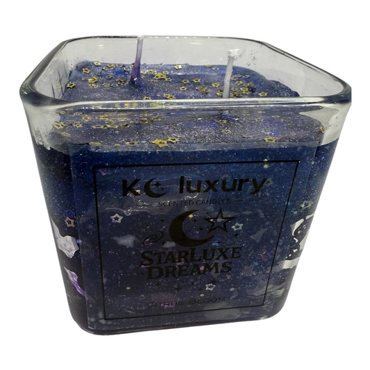 Galaxy-inspired StarLuxe Dreams candle with cosmic swirls and shimmering stars, by KC Luxury.
