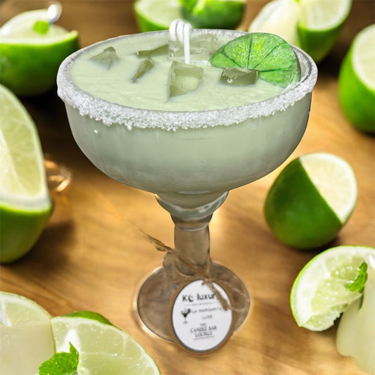 La Margarita Luxe Candle with realistic margarita design, set on a wooden surface with lime accents, from the Candle Bar Lounge Collection.