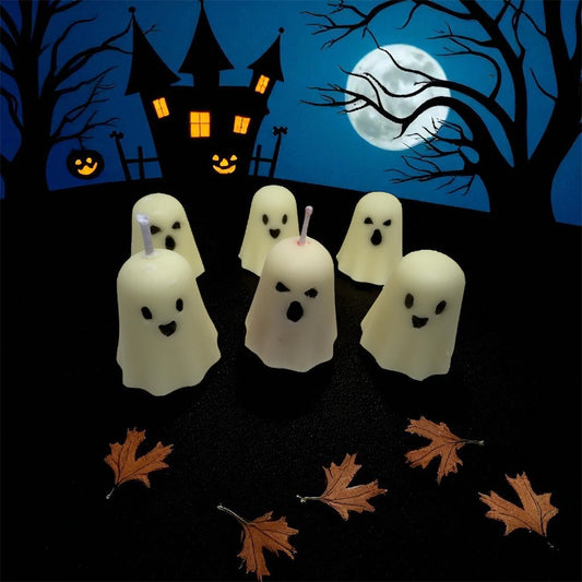 Set of six haunted ghost candles with one dripping red wax candle, Halloween spooky decoration against haunted house and full moon background