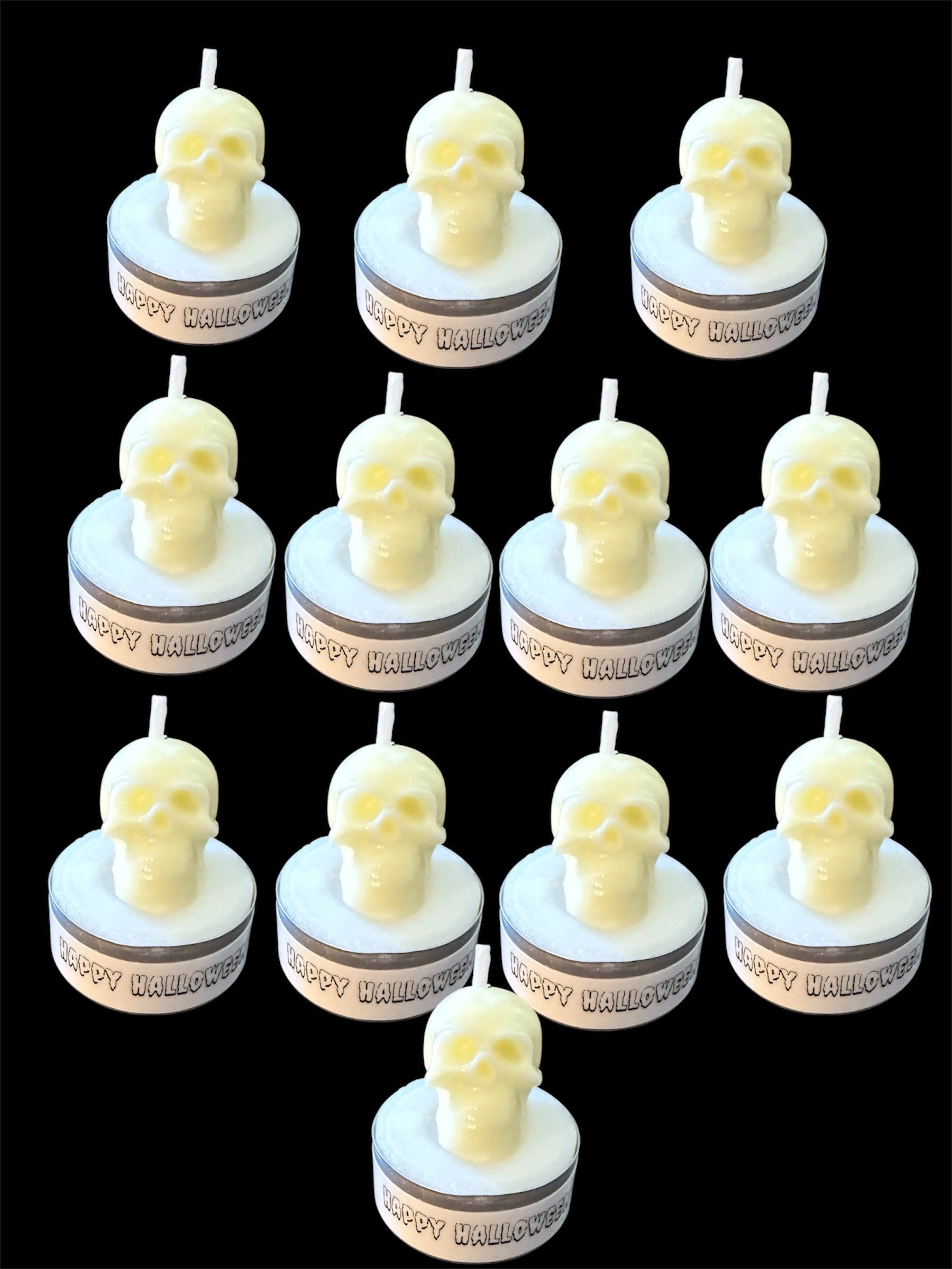 Set of 12 white skull tealight candles with "Happy Halloween" labels, perfect for spooky Halloween décor and party favors.