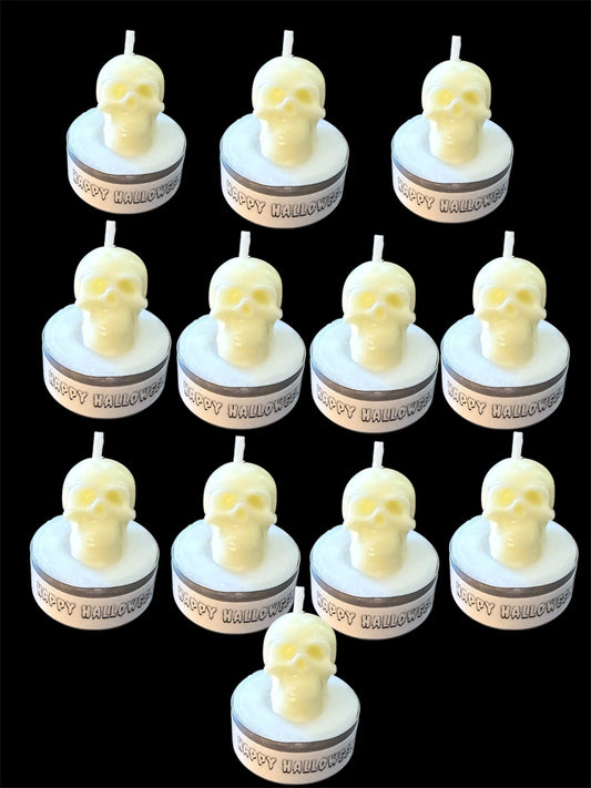 Set of 12 white skull tealight candles with "Happy Halloween" labels, perfect for spooky Halloween décor and party favors.