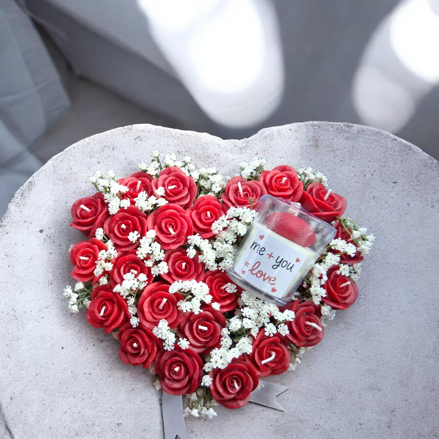 Romantic heart-shaped soy wax candle arrangement with red rose candles and white florals for Valentine’s Day gift